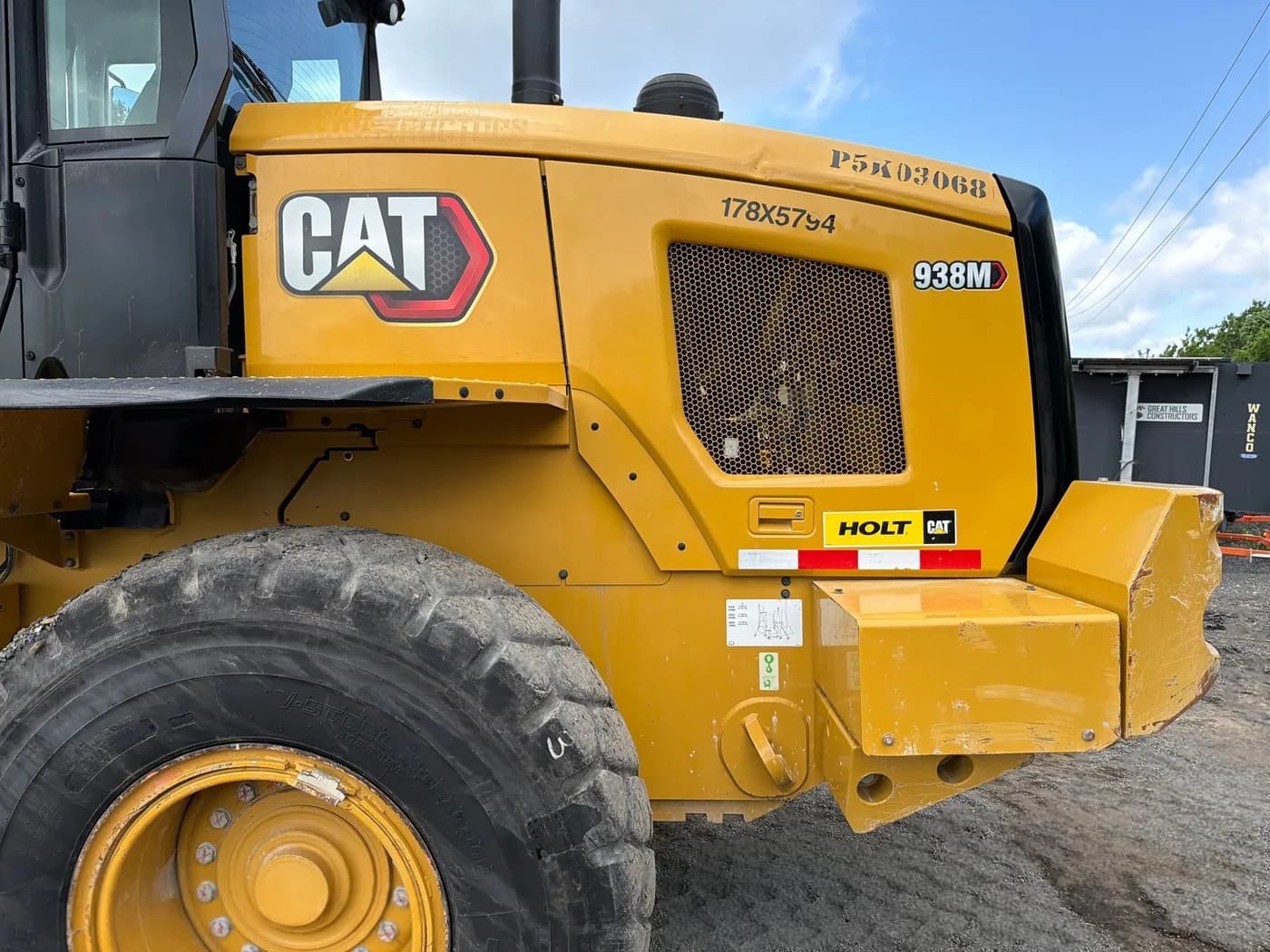 Model and serial decals on a Caterpillar 938M wheel loader