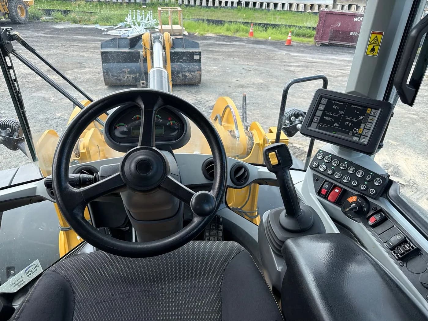Operator station and controls inside a Caterpillar 938M wheel loader